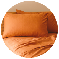 An Organic Cotton Sheet Set in the color terracotta orange