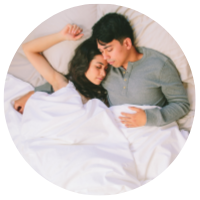 couple in bed covered with silk cloud comforter
